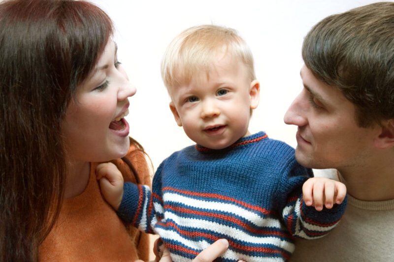 Happy family - father, mother and their cute little son